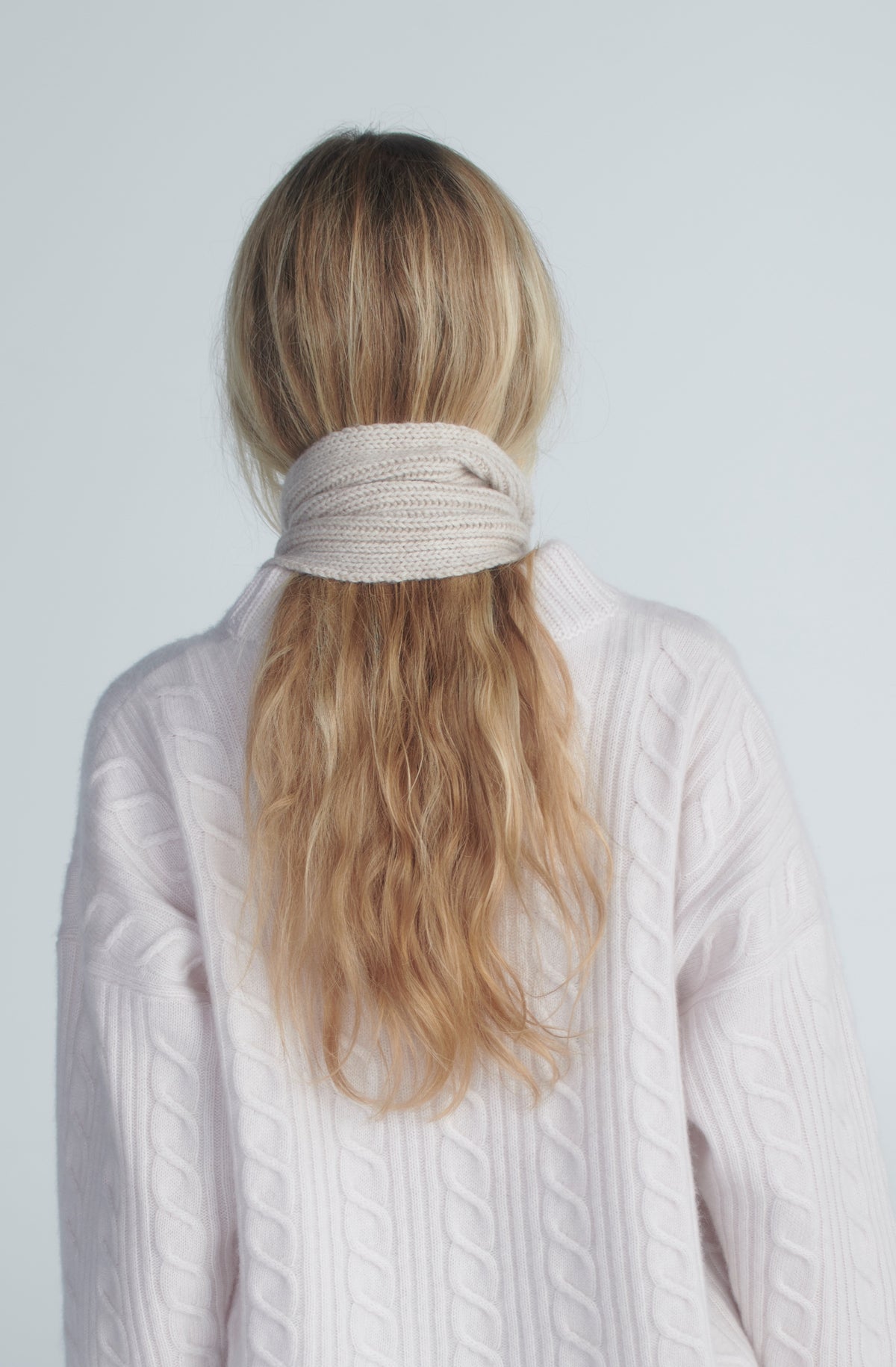 Striped cardigan styled with jeans and a burgundy scarf