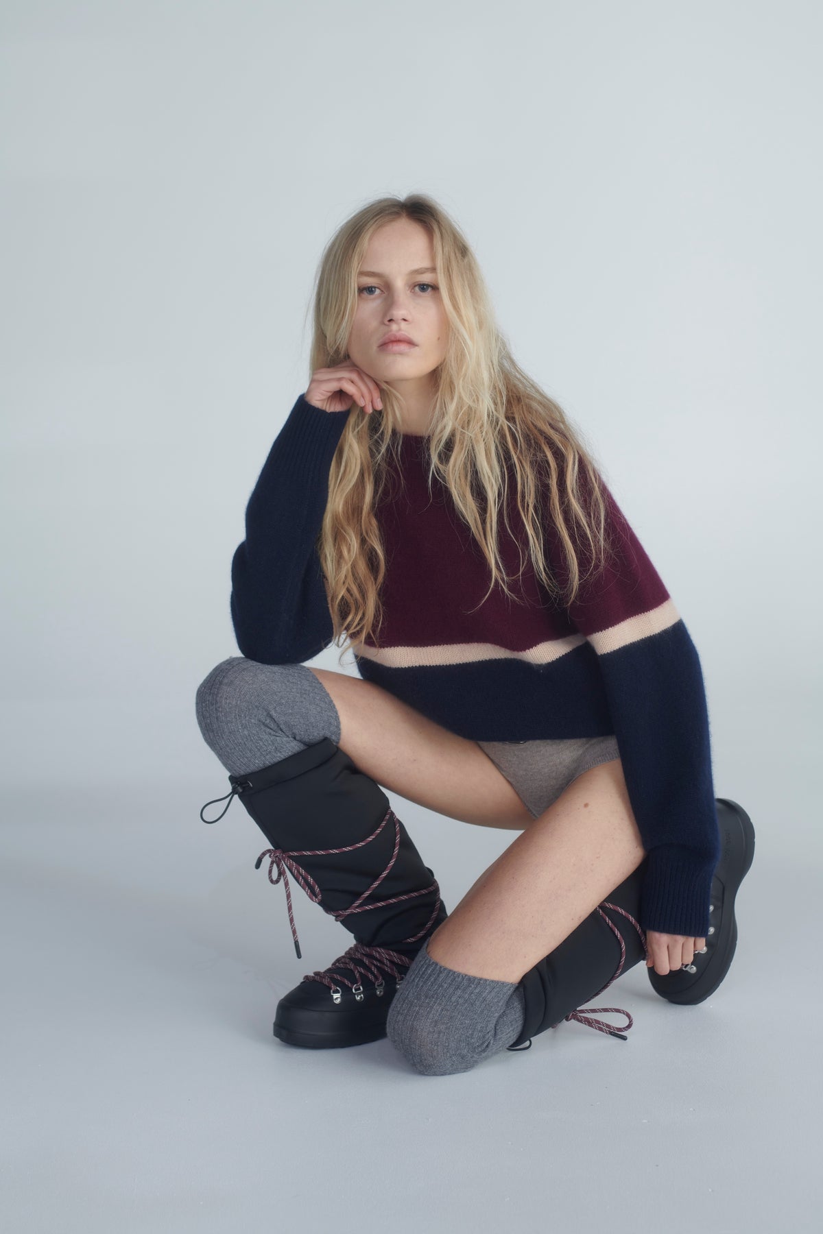 Burgundy and navy knit styled with boots