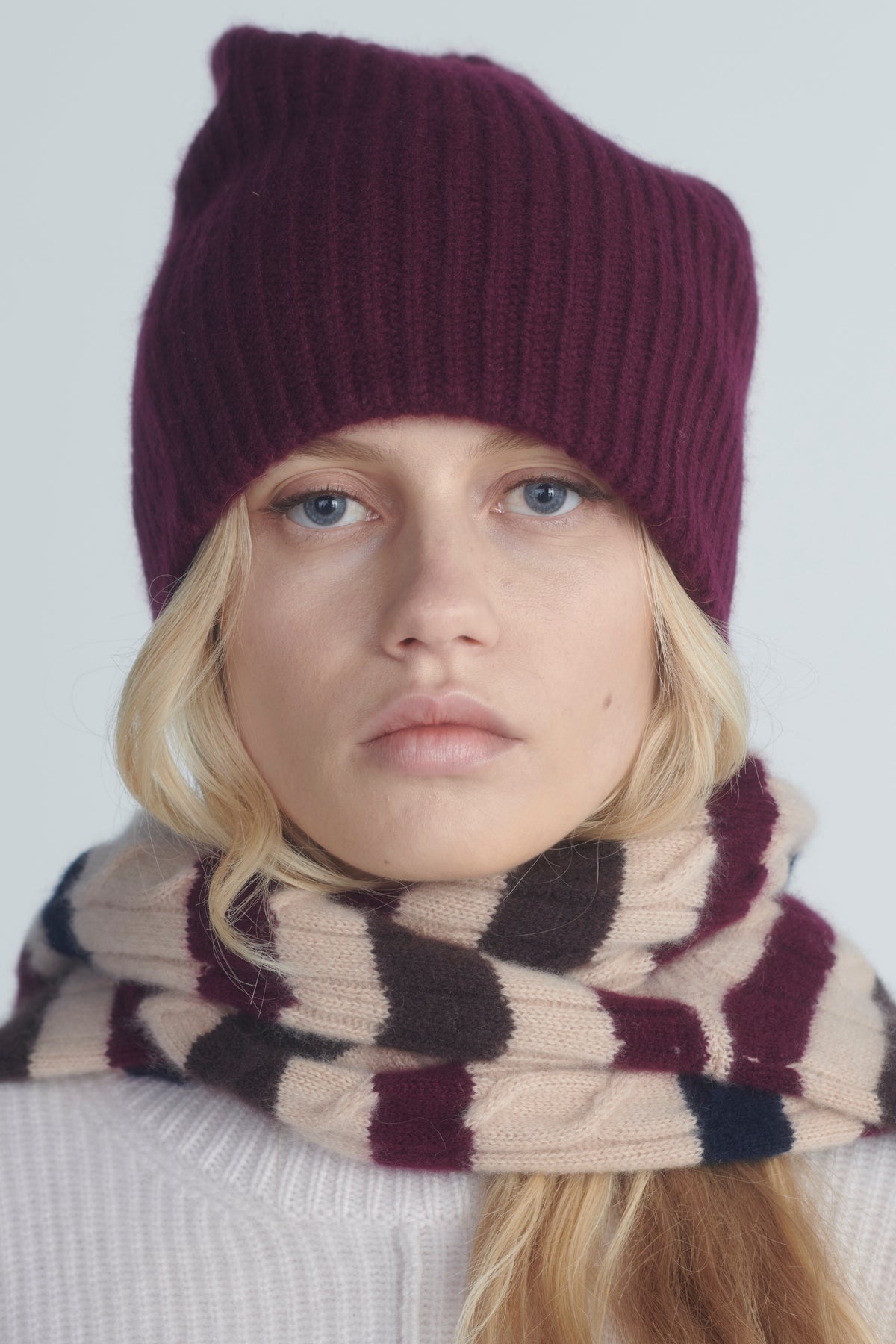 Close-up of the striped cardigan, buttons and knit texture