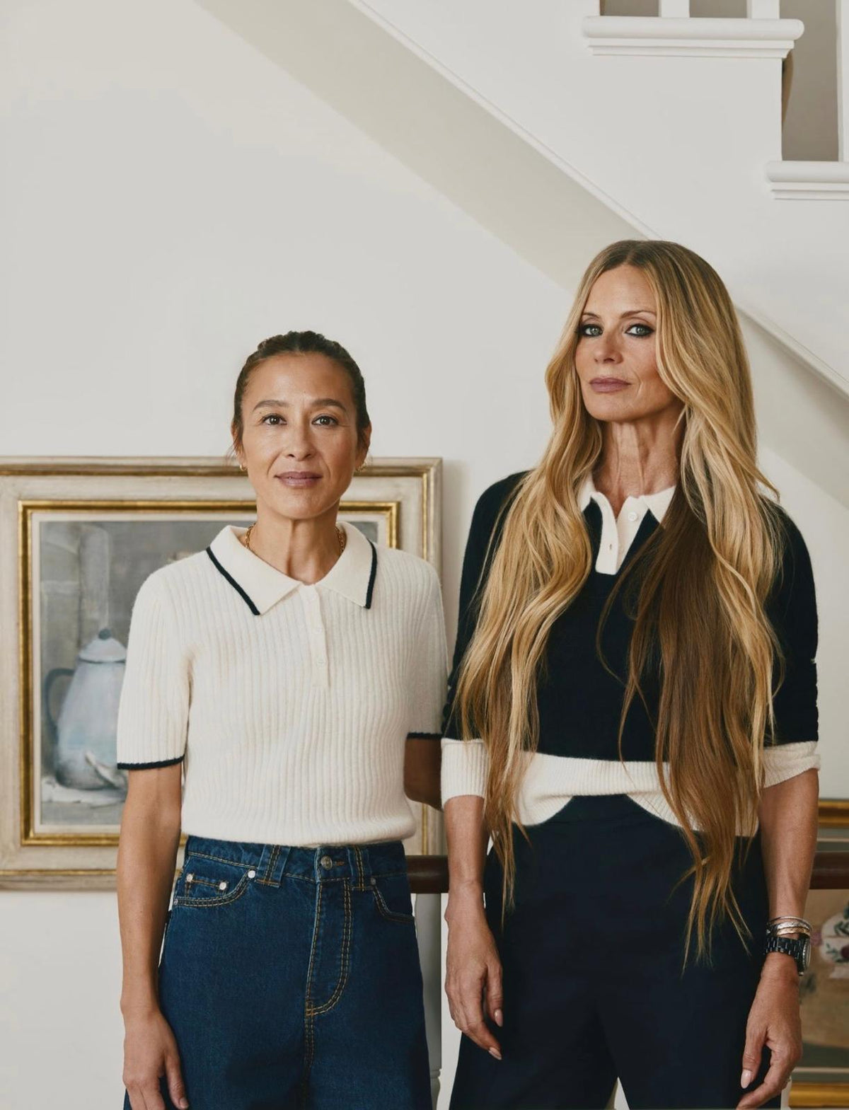 Madeleine Thompson and Laura Bailey in contrasting cream and black knitwear